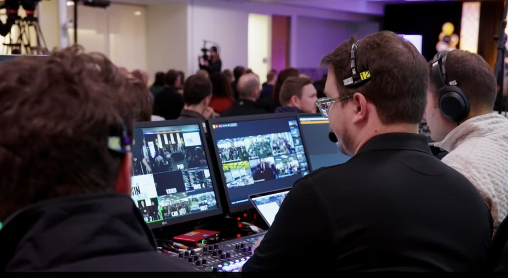 person looking at computer monitor at a livestream event